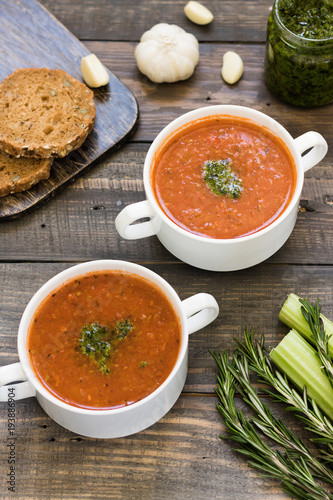 Thick Italian soup minestrone on a wooden table