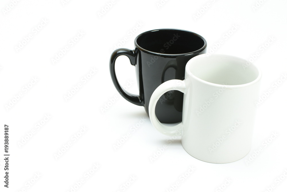 white coffee mug in front of black coffee mug, high key white coffee mug in front of black coffee mug, high key