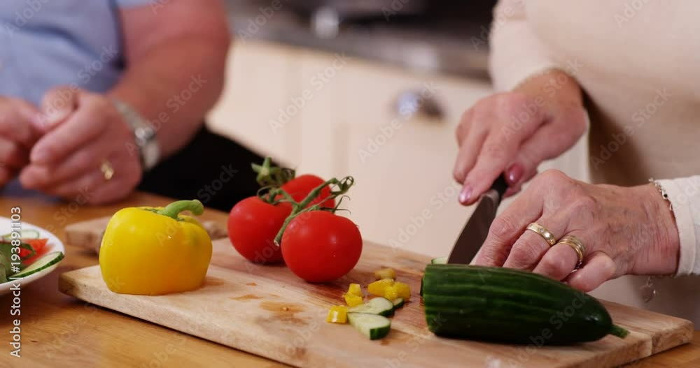 4k, Happy senior couples cuttin vegitables in their kitchen 4k, Happy senior couples cuttin vegitables in their kitchen