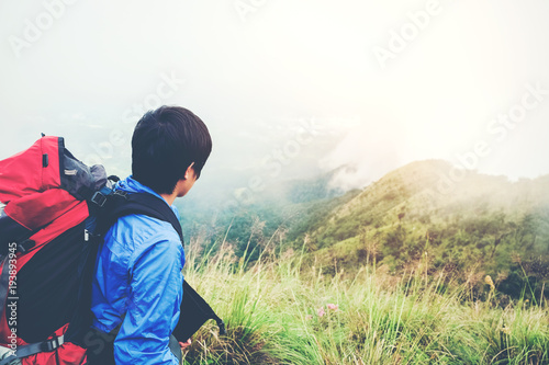 Tourist and Traveler Man with backpack the mountain in forest