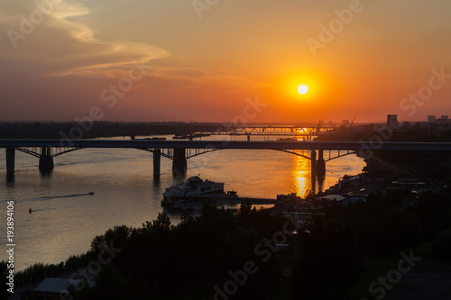 Beautiful sunset over the Octyabrsky bridge across river Ob in Novosibirsk © Julia Mashkova