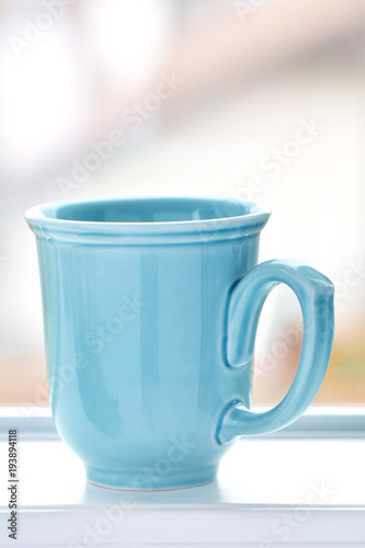 Blue mug with blurred bbackground