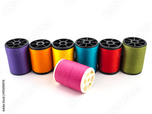 Thread rolls, Group of colorful thread on white background photo