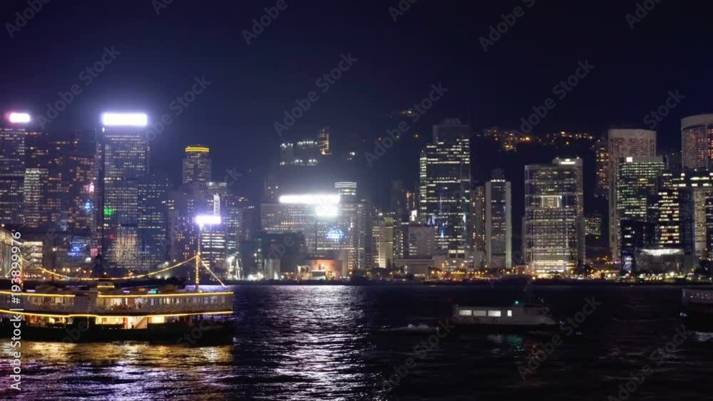 Hong Kong skyline at night. Boats crossing Victoria Harbor Hong Kong skyline at night. Boats crossing Victoria Harbor