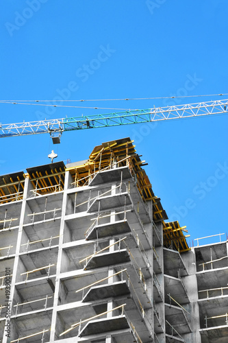 Crane and highrise construction site