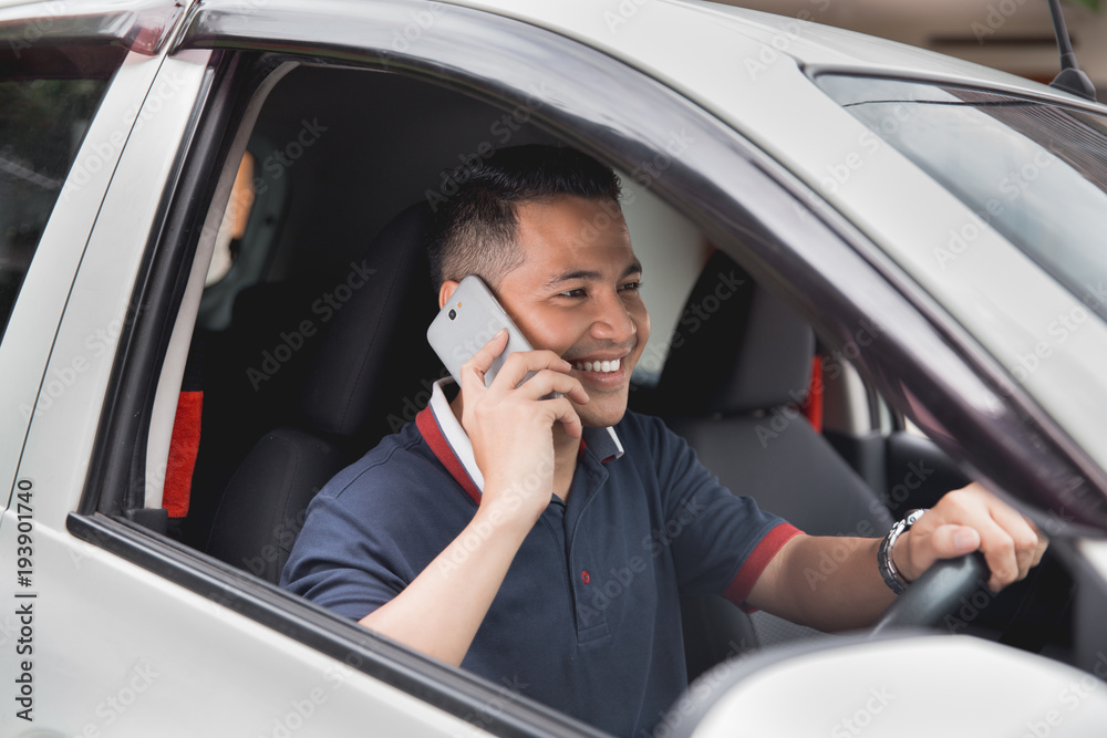 man calling while driving a car man calling while driving a car