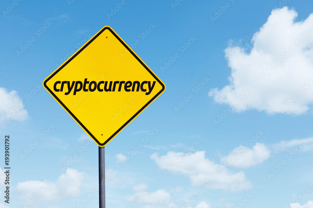 Cryptocurrency word on a yellow signpost Cryptocurrency word on a yellow signpost