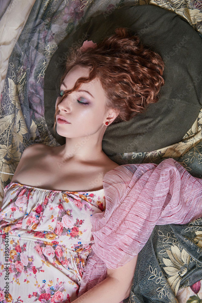 sleeping beautiful girl in flower colored cloth