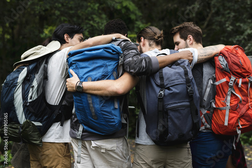 Trekking together in a forest