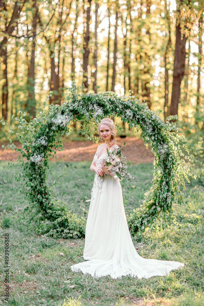 Wedding arch. Beautiful bride.