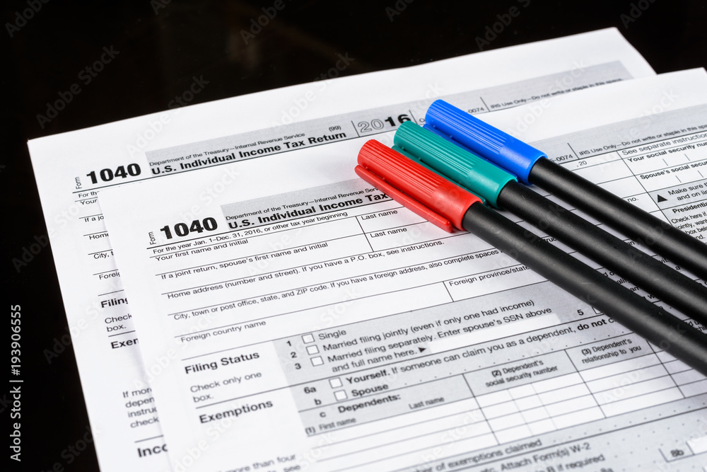 Obraz premium Form 1040 Individual Income Tax return form. United States Tax forms 2016/2017. American blank tax forms. Tax time.