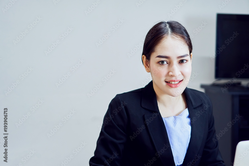 Business woman in a black suit of smiling asian young women the office. copy space for graphic ad. Business woman in a black suit of smiling asian young women the office. copy space for graphic ad.