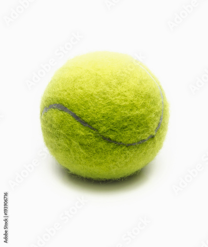 Bright green tennis ball on a white background close-up. © sv_production