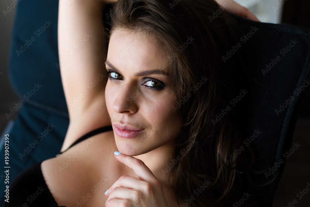 Beautiful young and glamorous woman wearing a black lingerie Beautiful young and glamorous woman wearing a black lingerie