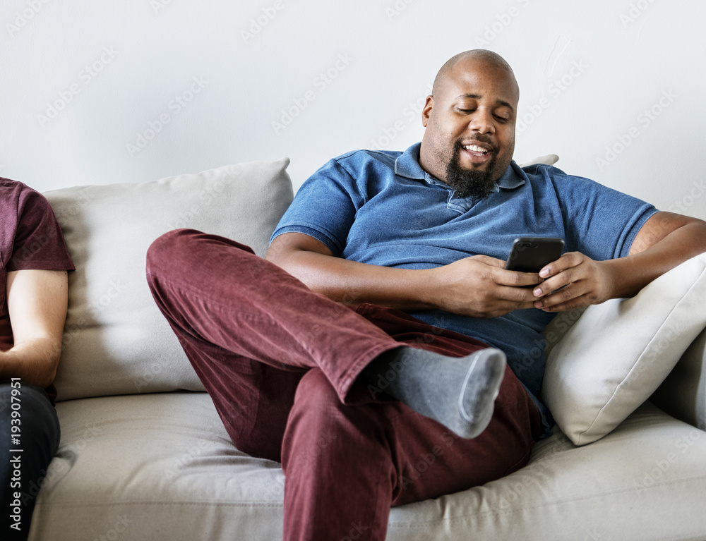 Black man using mobile phone
