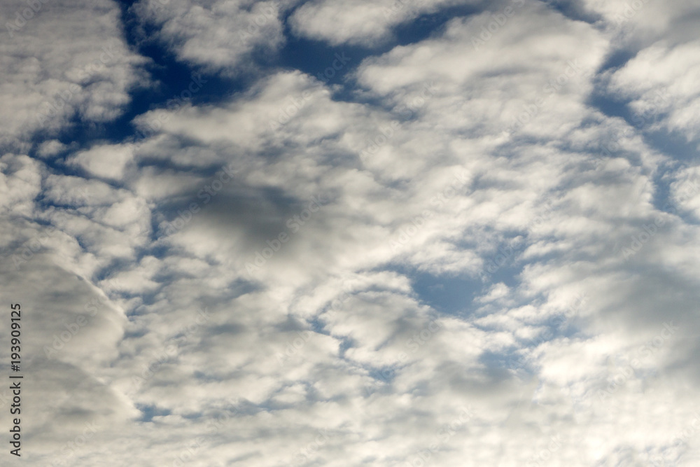Beautiful sun rays from behind clouds on blue sky. Beautiful sun rays from behind clouds on blue sky.