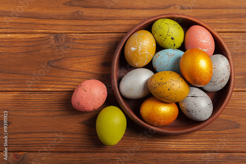 Happy easter! Easter eggs on wooden background