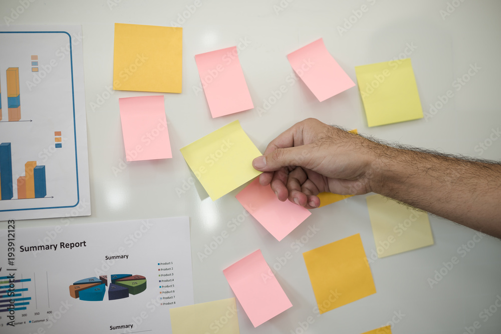 Hand of man holding post-it. for brainstorm strategy workshop business. Hand of man holding post-it. for brainstorm strategy workshop business.