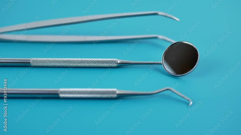 Professional Dentist tools in dental office dentist mirror, forceps