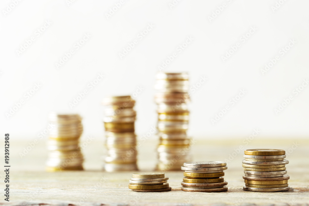 coins stack on wooden table