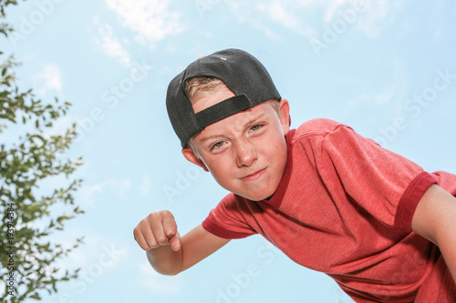 Bully making a fist looking down at his victim
