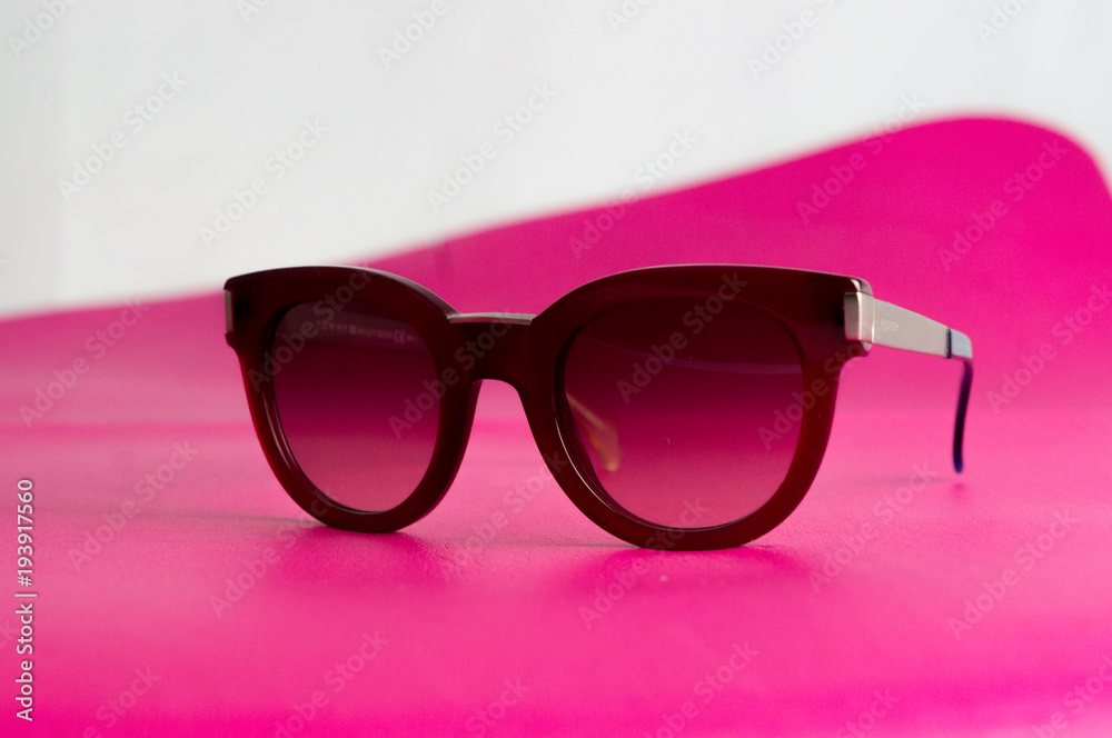 sunglasses lined up on a red background sunglasses lined up on a red background