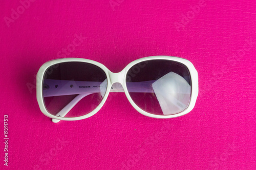 sunglasses lined up on a red background