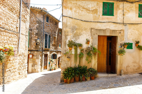Beautiful street in Valldemossa with traditional flower decoration  famous old mediterranean village of Majorca. Balearic island Mallorca  Spain