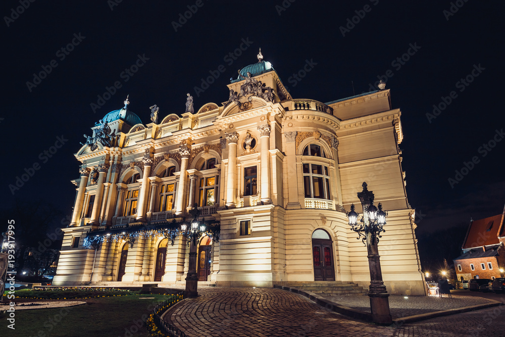 The Juliusz Slowacki Theater in the Old Town district in Krakow by night, Poland