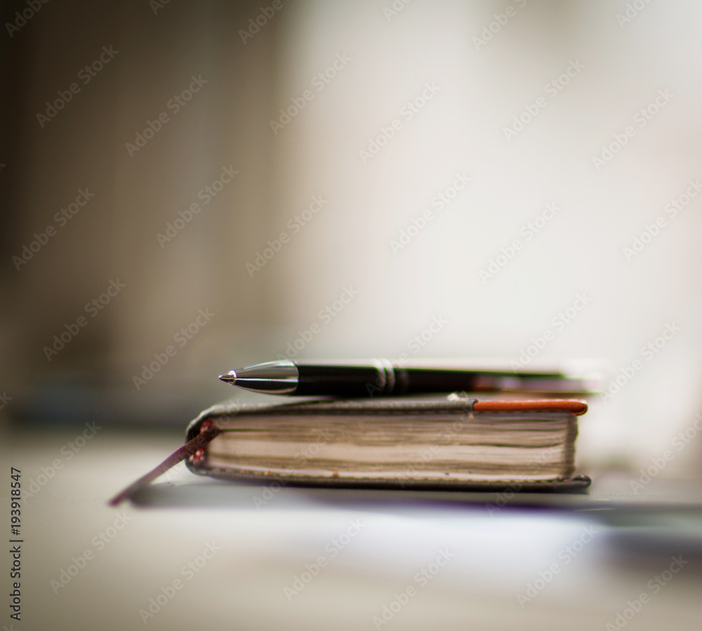 personal organizer and pen on office desk personal organizer and pen on office desk