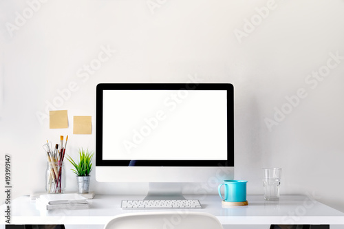 Mockup of creative desktop of designer with coffee mug.