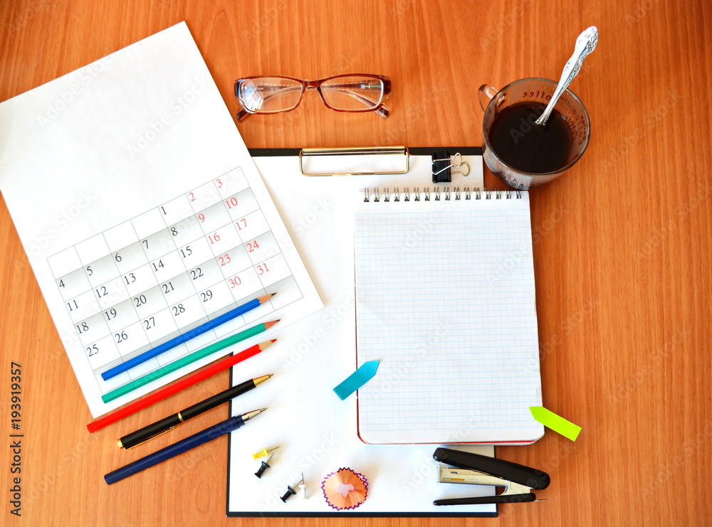Φωτογραφία Stationery set: cup of black strong coffee, glasses, color pencil, fountain pen,