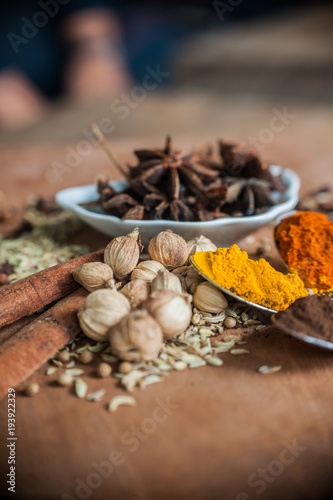 Various spices and herbs on wooden table © Martanto Setyo H