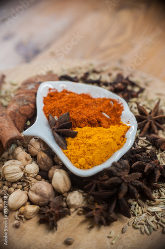 Various spices and herbs on wooden table