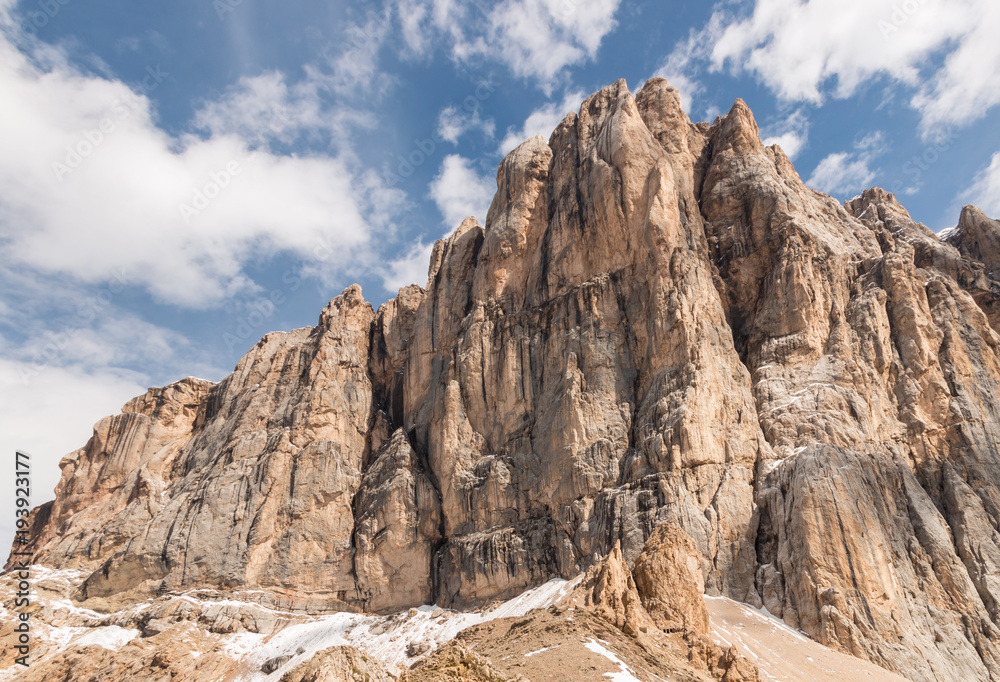 south rock face of Marmolada mountain ridge in Dolomites, Italy