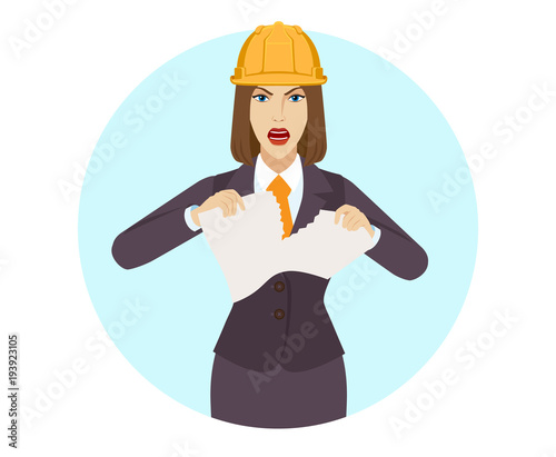 Businesswoman in construction helmet  tearing paper