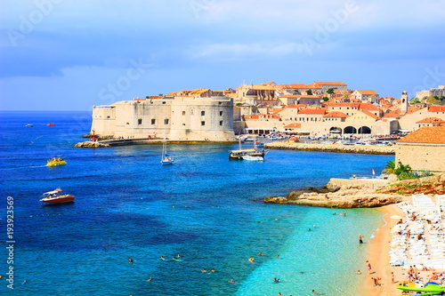 Fototapeta Naklejka Na Ścianę i Meble -  Dubrovnik, touristis destination in Croatia, panorama of old town and beautiful beach Banje with clear blue sea