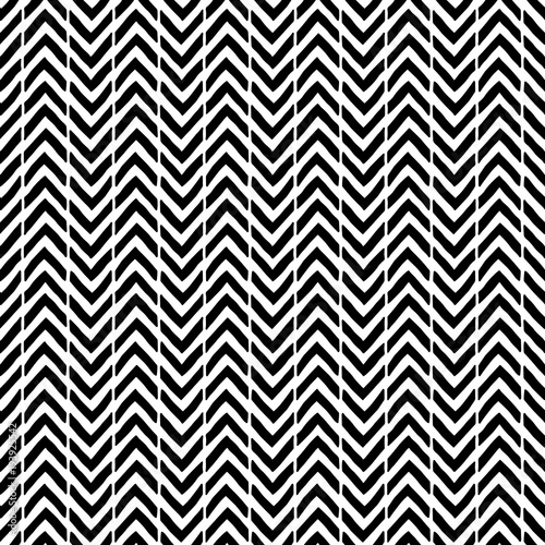 Simple seamless abstract pattern. Black and white print. Strips in the form of a zigzag.