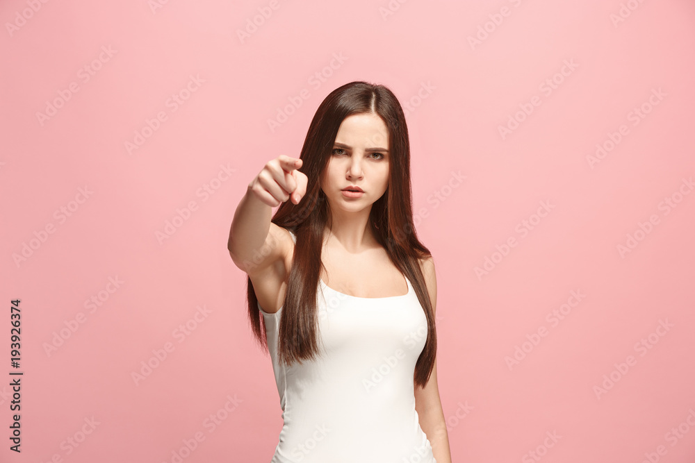 The overbearing business woman point you and want you, half length closeup portrait on pink background.