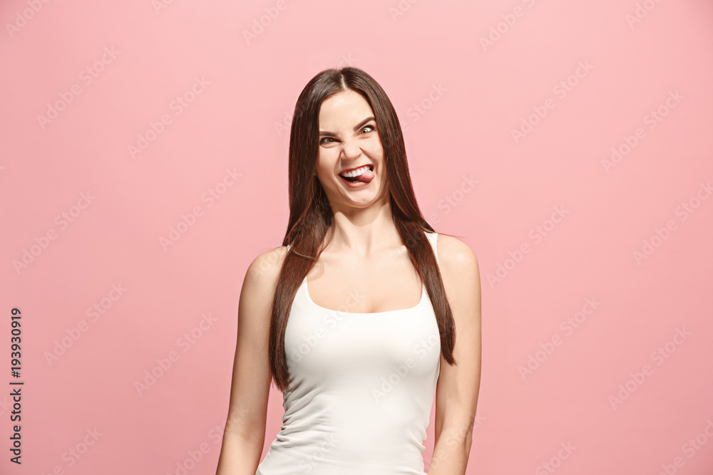 The squint eyed woman with weird expression isolated on pink The squint eyed woman with weird expression isolated on pink