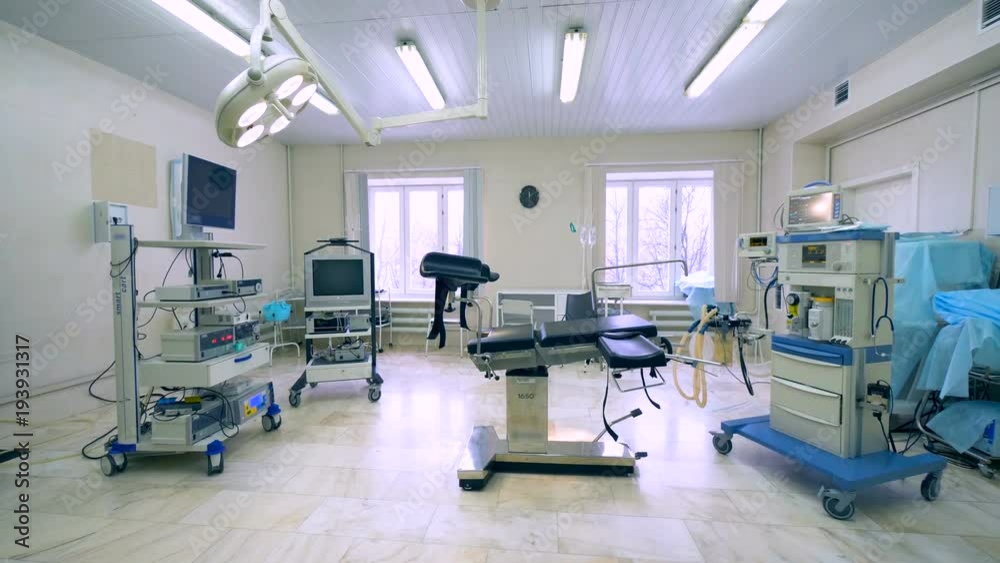 General view of a gynecological medical room filled with hospital equipment General view of a gynecological medical room filled with hospital equipment
