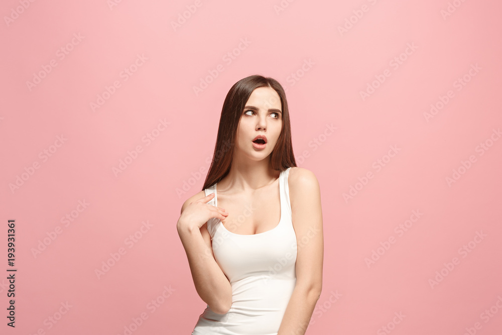 Let me think. Doubtful pensive woman with thoughtful expression making choice against pink background Let me think. Doubtful pensive woman with thoughtful expression making choice against pink background