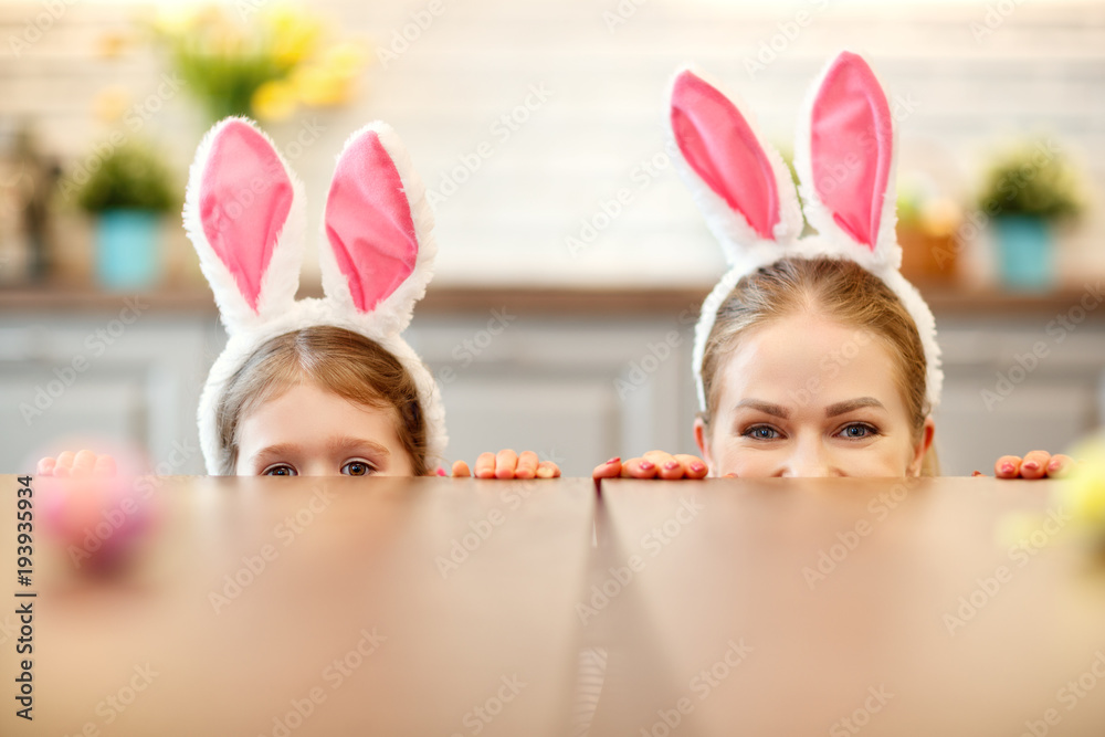 Happy easter! happy family mother and daughter with hare ears Happy easter! happy family mother and daughter with hare ears