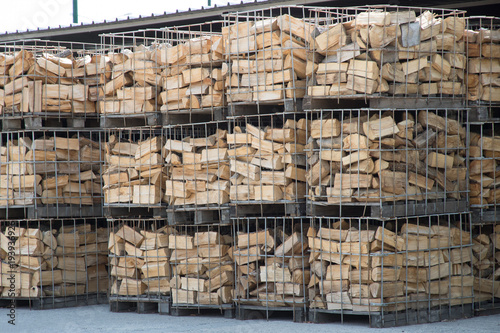 Firewood in metal containers;