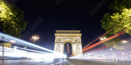 Arc de Triomphe and car lights at night