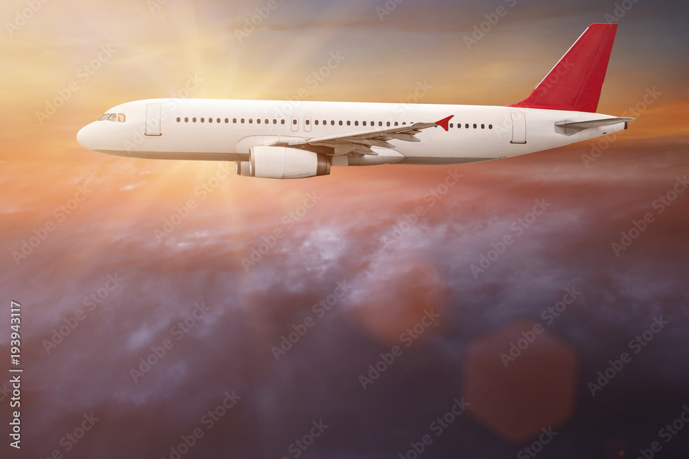 Obraz premium Commercial airplane flying above clouds.