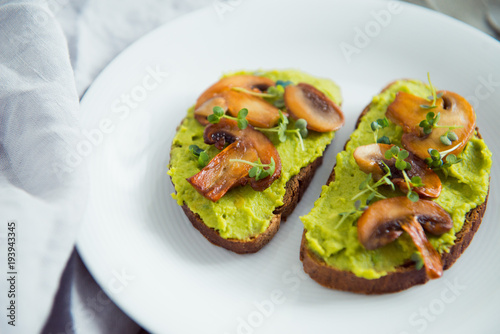 toast avocado and fried mushrooms with bean sprouts