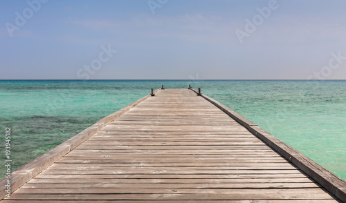 Wooden jetty and beautiful ocean in Maldives