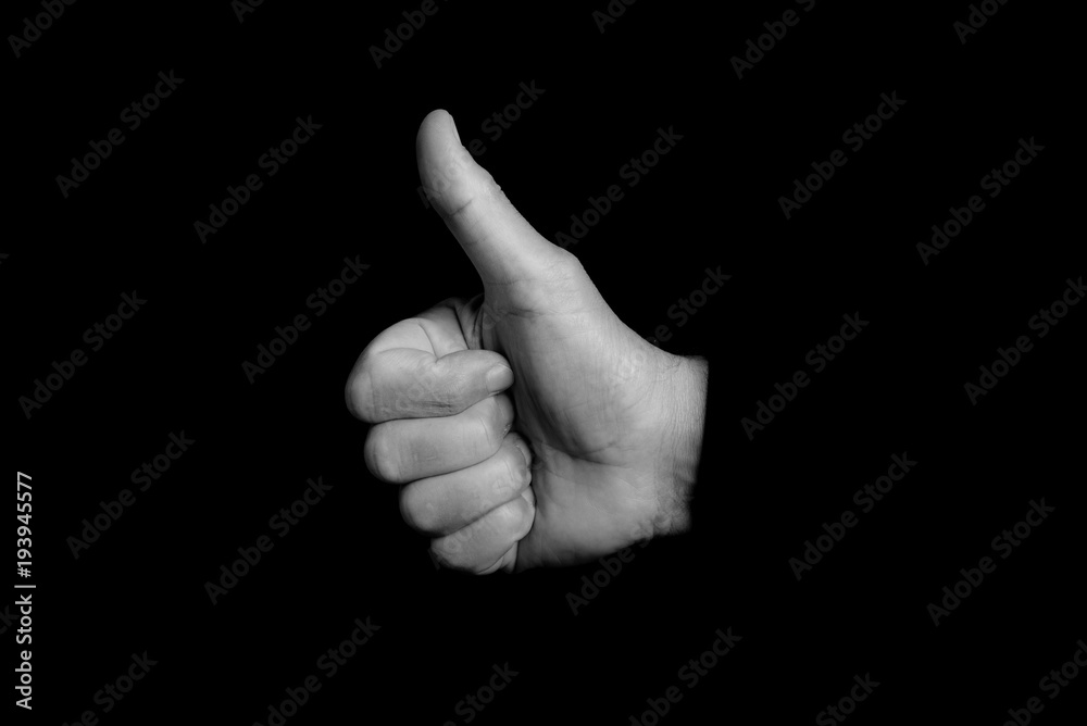 ok sign - hand gestures on a black background - black and white photo ok sign - hand gestures on a black background - black and white photo