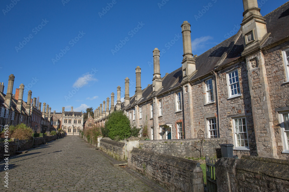 Vicars Close next to Wells Cathedral Somerset England uk historic row of cottages, houses and chimneys 